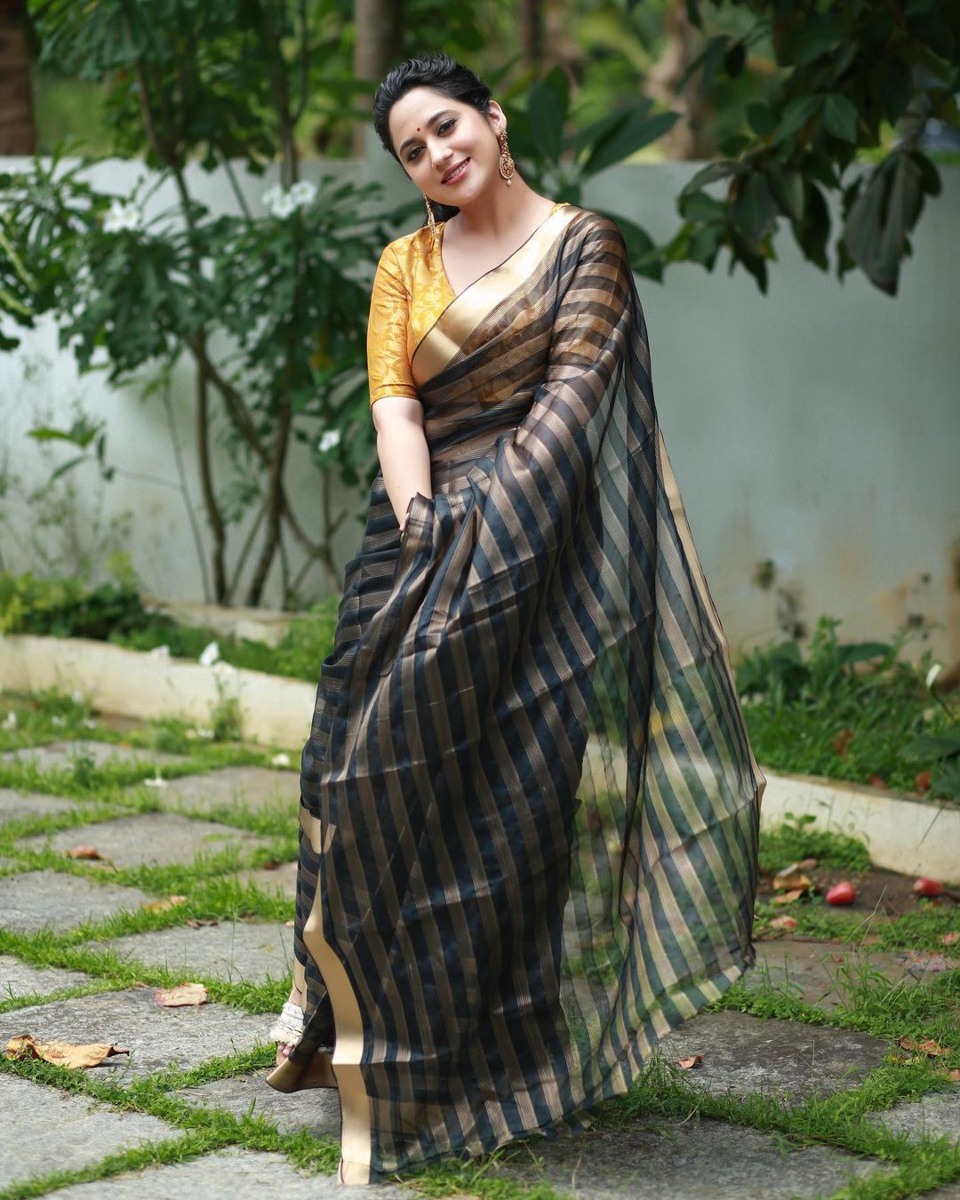 malayalam actress miya george stills in black saree yellow blouse